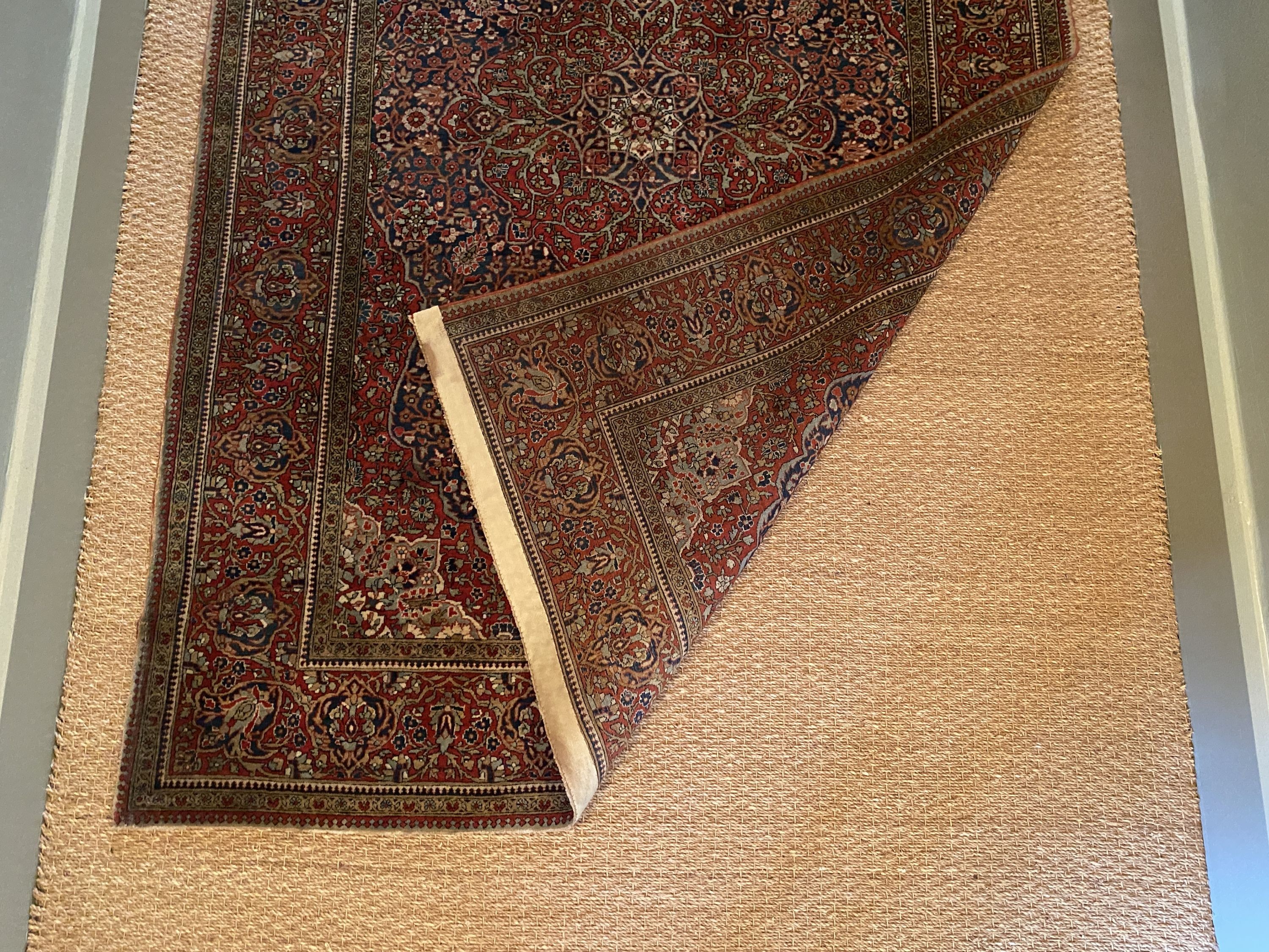 A fine Isphahan red ground rug, with central floral medallion, multi-bordered, 197 x 129cm
